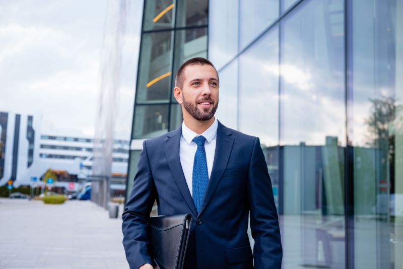 a man in a suit holding a briefcase